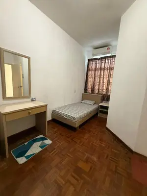 a bedroom with a bed and a desk and a mirror at Haven Nine Homestay in Batu Ferringhi