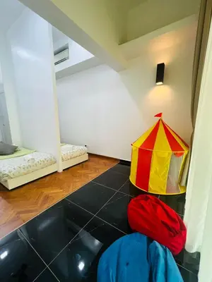 a room with a circus tent on the floor at Marina Chic l Stylish 2BR Retreat l Straits Quay in Tanjung Bungah