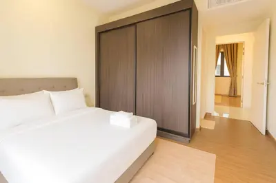 a bedroom with a large white bed and a sliding door at \u3010Lux\u3011HighFloor wi SunSet | Infinity Pool | KTV 207 in George Town