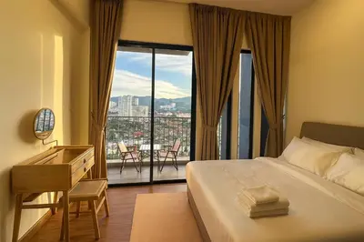 a bedroom with a bed and a desk and a large window at \u3010Lux\u3011HighFloor wi SunSet | Infinity Pool | KTV 207 in George Town