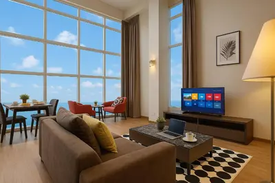 a living room with a couch and a tv at \u3010SeaView\u3011High Floor 2BR Duplex SeaFront-Town 20 in George Town