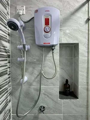 a shower in a bathroom with a blow dryer at #15mins walk to Kea Farm#4bedrooms4bathrooms#10pax in Brinchang