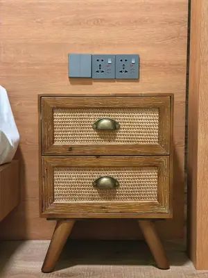 a nightstand with two drawers and a socket on it at #15mins walk to Kea Farm#4bedrooms4bathrooms#10pax in Brinchang