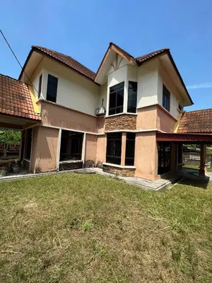 a house with a large yard in front of it at GS Homestay Whole Villa in Gertak Sanggul