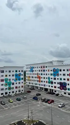 two large white buildings with google signs on them at Teratak Burung Darimi in Kampong Bota Road