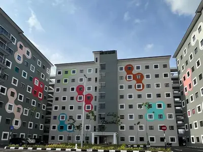 a building with colorful squares on the side of it at Teratak Burung Darimi in Kampong Bota Road