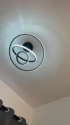 a pendant light hanging from the ceiling of a room at Teratak Burung Darimi in Kampong Bota Road