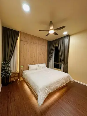 a bedroom with a bed with a ceiling fan at The Cozy Wooden Stay #PalasHorizon#5-7 minutes to Kea Farm in Brinchang