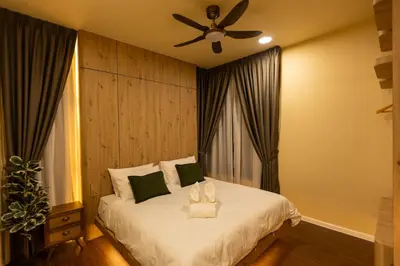 a bedroom with a white bed with a ceiling fan at The Cozy Wooden Stay #PalasHorizon#5-7 minutes to Kea Farm in Brinchang