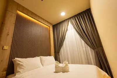 a bedroom with a white bed with a window at The Cozy Wooden Stay #PalasHorizon#5-7 minutes to Kea Farm in Brinchang