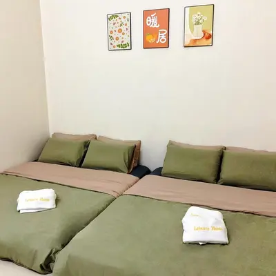 two beds sitting next to each other in a room at 10min near Ipoh Town Family Old & New Style 8Px in Ipoh