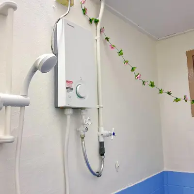 a shower in a hospital room with flowers on the wall at 10min near Ipoh Town Family Old & New Style 8Px in Ipoh