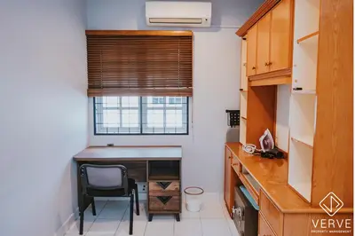 a kitchen with a desk and a chair in a room at Luxe Retreat Homestay by Verve in Ipoh