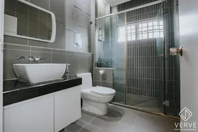 a bathroom with a sink and a toilet and a shower at Luxe Retreat Homestay by Verve in Ipoh