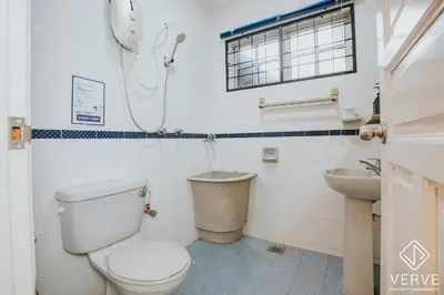a bathroom with a toilet and a sink at Luxe Retreat Homestay by Verve in Ipoh