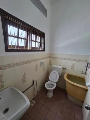 a bathroom with a tub and a toilet and a sink at Ipoh Stadium Hostel in Ipoh