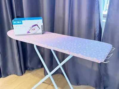 a pink and white table with a box on it at relaxing home in Bukit Mertajam in Bukit Mertajam