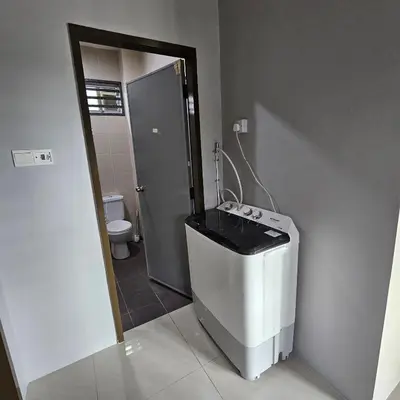 a small bathroom with a toilet and a sink at Residensi Lourve Homestay Sungai Petani in Sungai Petani