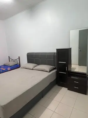 a bedroom with a bed and a dresser with a mirror at Lake View From Bed Peaceful Getaway Home in Ipoh