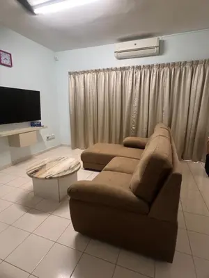 a living room with a couch and a tv at Lake View From Bed Peaceful Getaway Home in Ipoh