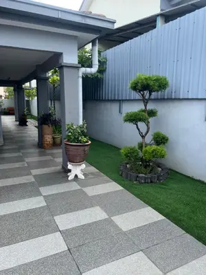 a courtyard with trees and plants in a building at Lake View From Bed Peaceful Getaway Home in Ipoh