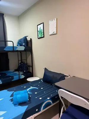 a room with two bunk beds with blue sheets at Big Big Big family escape 4BR side pool view, Ipoh in Ipoh
