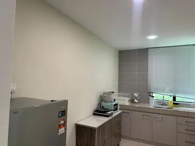 a kitchen with a stainless steel refrigerator and a window at Big Big Big family escape 4BR side pool view, Ipoh in Ipoh