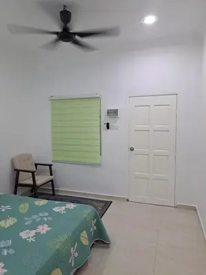 a bedroom with a bed and a ceiling fan at Teratak Sumayyah 2 - For Islam only - Pondok Lenggong in Kampong Banggol Belimbing