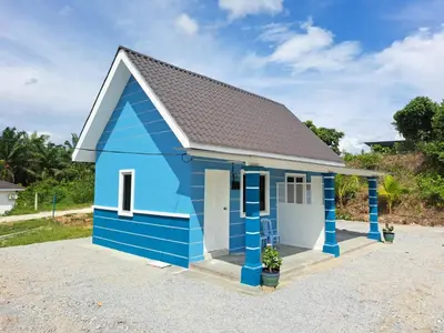 a blue shed with a grey roof at Teratak Sumayyah 2 - For Islam only - Pondok Lenggong in Kampong Banggol Belimbing