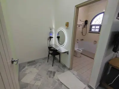 a bathroom with a sink and a mirror at sunshine bnb concept service in Ipoh