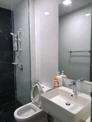 a bathroom with a sink and a toilet and a mirror at Beacon Executive Suite in Jalan Sungai Pinang George Town in George Town