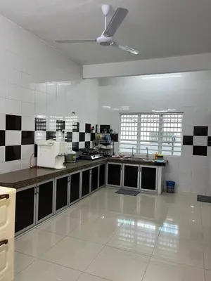 a large kitchen with black and white tiles on the wall at Silibin Family 4B3B Homestay 11pax by Iconique in Ipoh