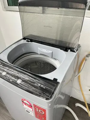 a washing machine with a window on top of it at Silibin Family 4B3B Homestay 11pax by Iconique in Ipoh