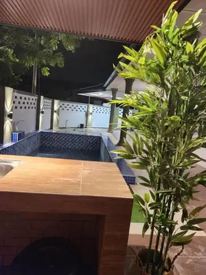 a swimming pool in a house with a plant at Sun Vista Home by Ipoh Maju Stay in Ipoh