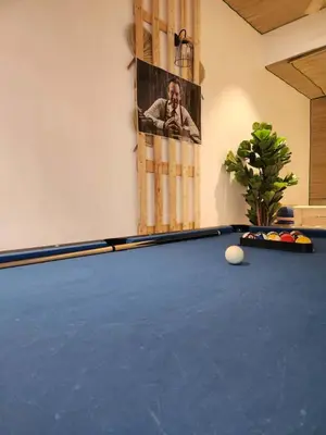 a pool table in a room with a picture on the wall at Sun Vista Home by Ipoh Maju Stay in Ipoh