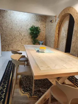 a wooden table and chairs in a room at Sun Vista Home by Ipoh Maju Stay in Ipoh