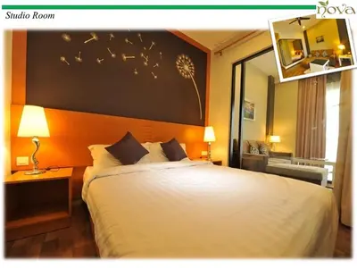 a bedroom with a large bed with birds flying overhead at Cameron Nova Highlands Resort VI in Brinchang