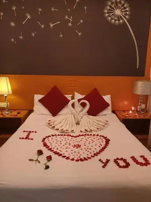 a bedroom with a bed with a peace sign on it at Cameron Nova Highlands Resort VII in Brinchang
