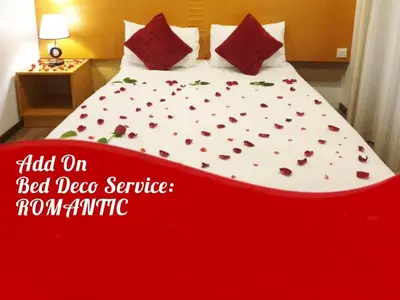 a red and white bed in a room with hearts on it at Cameron Nova Highlands Resort VII in Brinchang