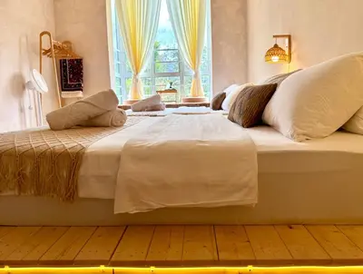 a large white bed in a room with a window at Asa and Mori Japandi, Emerald Avenue, Brinchang in Tanah Rata