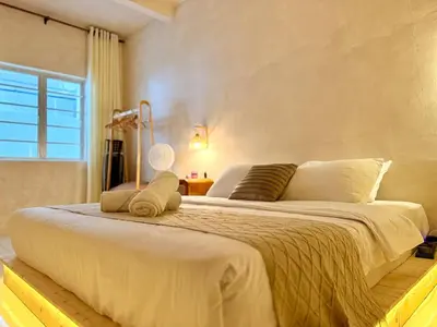 a large white bed in a room with a window at Asa and Mori Japandi, Emerald Avenue, Brinchang in Tanah Rata
