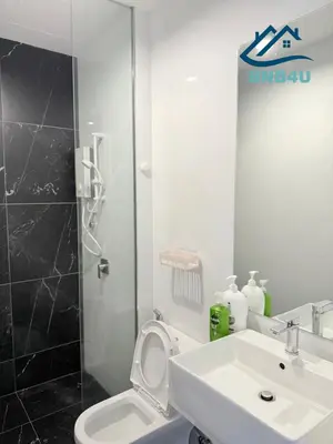 a bathroom with a sink and a toilet and a shower at Beacon 2 bedroom at Jalan Sungai Pinang George Town Penang in George Town