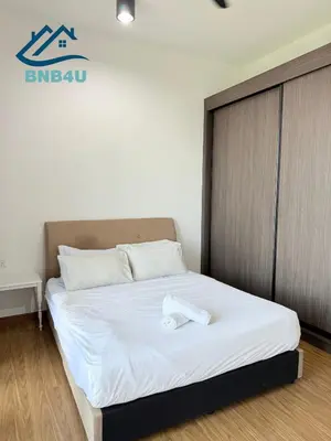 a bedroom with a bed with a white pillow on it at Beacon 2 bedroom at Jalan Sungai Pinang George Town Penang in George Town