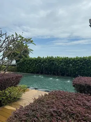 a pool of water with a fountain in a garden at Beacon 2BR with Infinity Pool at Jalan Sungai Pinang George Town Penang in George Town