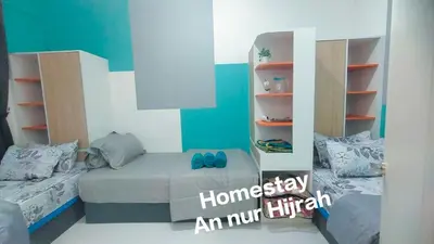 a bedroom with a bed and a book shelf at Homestay Annur Hijrah Seri Iskandar Near UiTM ,UTP in Seri Iskandar