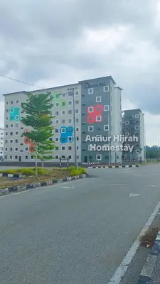 a large building with colorful signs on the side of it at Homestay Annur Hijrah Seri Iskandar Near UiTM ,UTP in Seri Iskandar