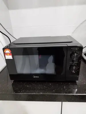 a black toaster oven sitting on top of a counter at RoomB w attached bathroom w bathtub in George Town