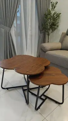 a wooden coffee table and a couch in a living room at Sofea Stay Homestay Sungai Petani in Sungai Petani