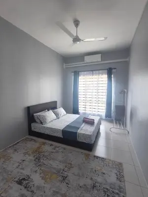 a bedroom with a bed and a window at HS homestay Casa Klebang Ipoh in Ipoh