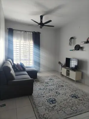a living room with a couch and a ceiling fan at HS homestay Casa Klebang Ipoh in Ipoh